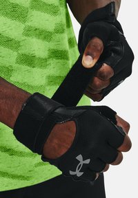 Black fitness gloves with exposed fingers, featuring a textured grip and adjustable velcro straps. The logo is prominently displayed.