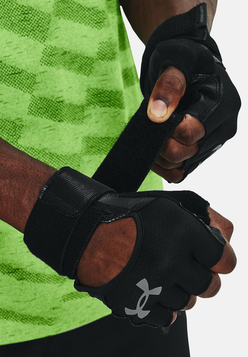 Black fitness gloves with exposed fingers, featuring a textured grip and adjustable velcro straps. The logo is prominently displayed.
