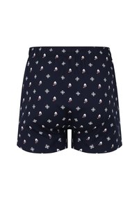 Granatowe bokserki z powtarzającym się wzorem czapek Świętego Mikołaja i płatków śniegu, wykonane z bawełny, z elastycznym paskiem w talii dla wygody.