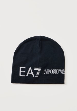 Bonnet noir en tricot avec logo et emblème blancs "EA7 Emporio Armani" à l'avant.