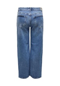 Siniset farkut leveällä lahkeella näkyvät takaa, jossa on kaksi takataskua ja näkyvä vyötärölinja vyölenkeillä.