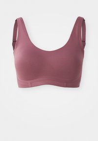 Sømløs mauve sports-bh med brede justerbare stropper og dyp halsutringning, designet for komfort og støtte.