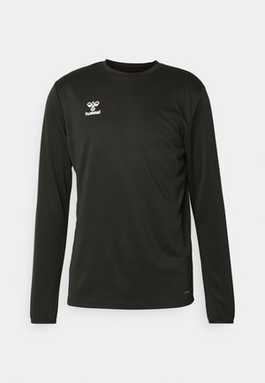 Camisa atlética de manga larga negra en tejido que absorbe la humedad, con un cuello redondo y un logotipo blanco en la parte superior izquierda del pecho.