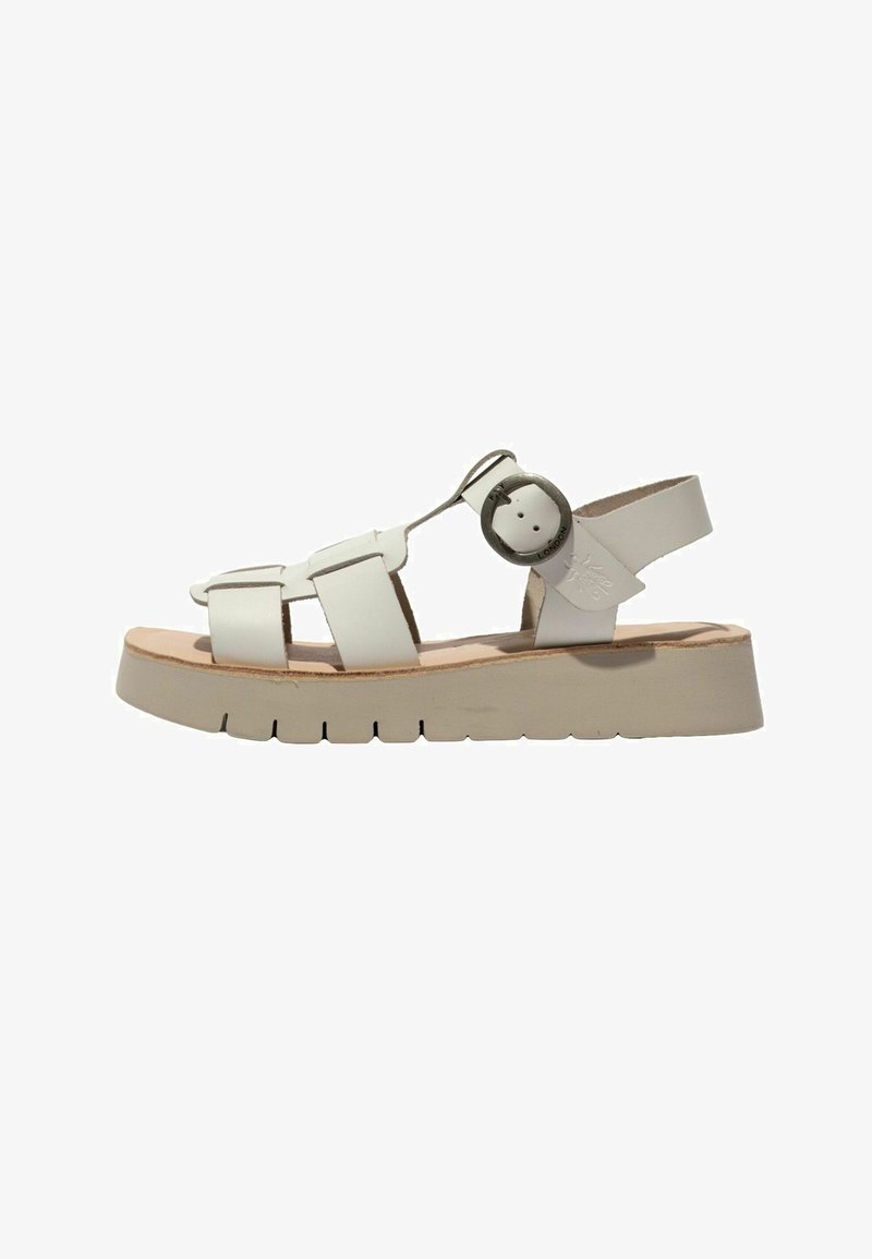 White leather sandal with thick sole, open toe, multiple straps, and round metal buckle on the side.