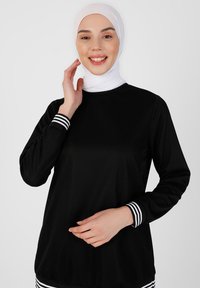 Modanisa SET TAVIN - Træningssæt - black