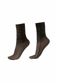 Calzini neri trasparenti fino alla caviglia con texture arricciata, ornati da piccoli accenti simili all'argento, con aree del piede e del tallone rinforzate.