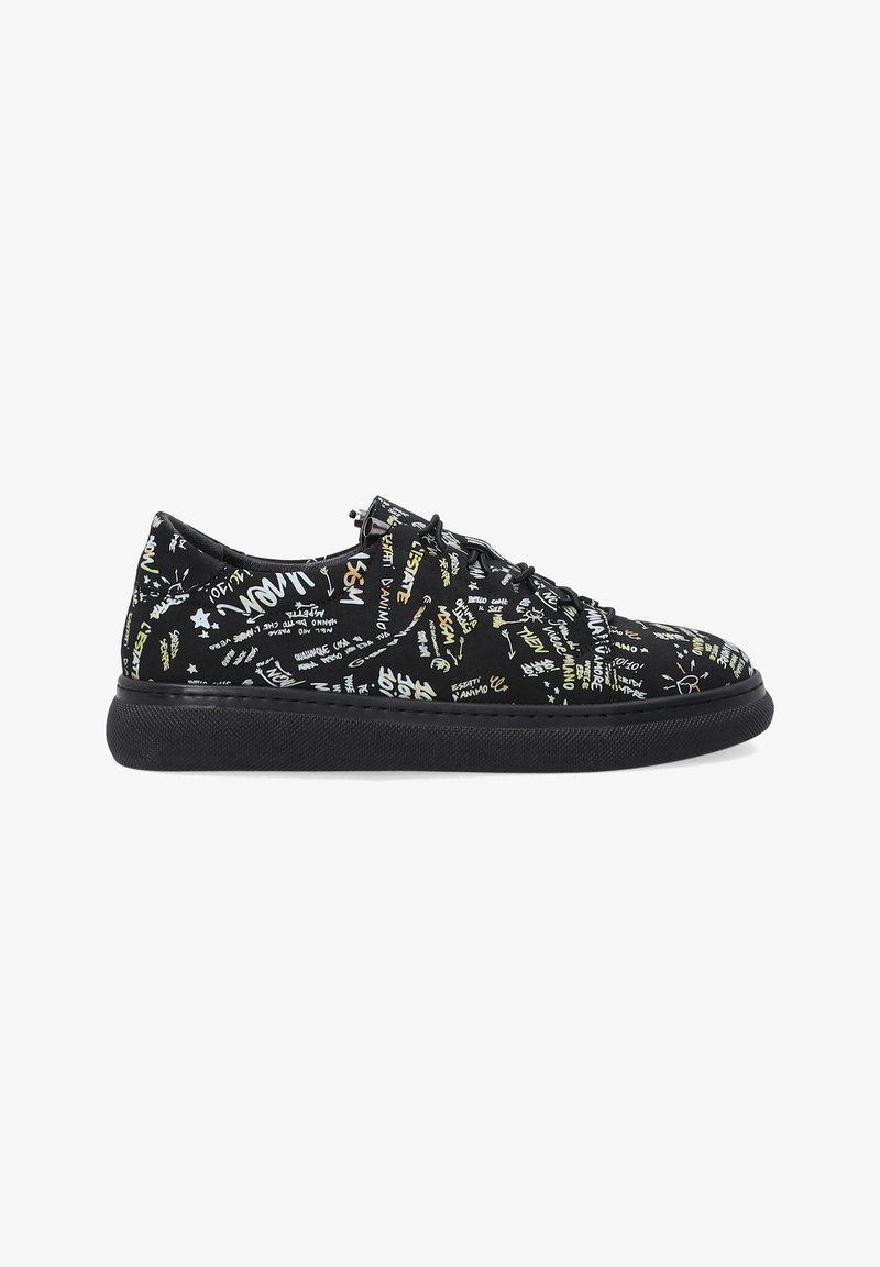 Black sneakers with a textured fabric upper featuring multicolored text and graphic patterns. Rubber sole, lace-up design, and rounded toe.