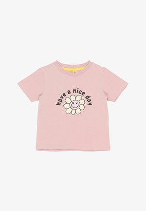 Camiseta de algodón rosa con mangas cortas y un cuello redondo. Presenta un gráfico de una flor sonriente y el texto "que tengas un buen día."