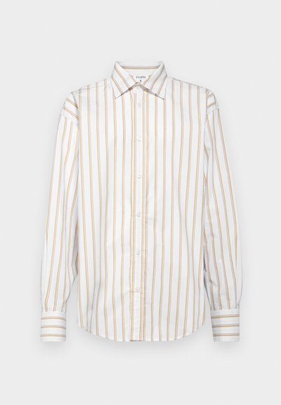 Stripet, langermet skjorte i hvit og lys gul, med krage som kan kneppes ned, frontlås og ermer med matchende striper.