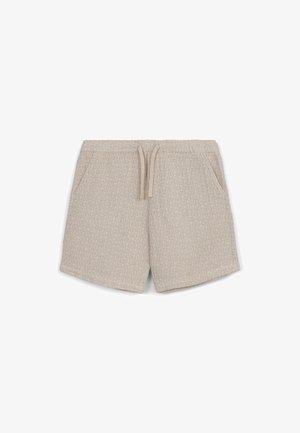 Shorts beiges en tissu texturé, avec une taille élastique à cordon de serrage, deux poches latérales et une coupe décontractée.