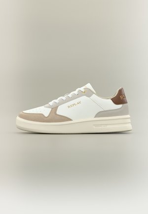 White low-top sneaker with beige suede accents, brown heel tab, cream sole, and "REPLAY" gold lettering on side and heel.
