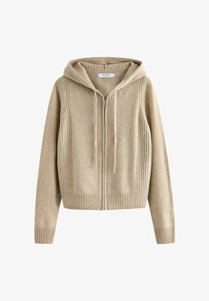 Bees värvi villane kapuutsiga dressipluus, millel on lukk ees, soonilised detailid ja reguleeritav pael kapuutsis. Pehme tekstuur ja lühike lõige täiustavad selle välimust.