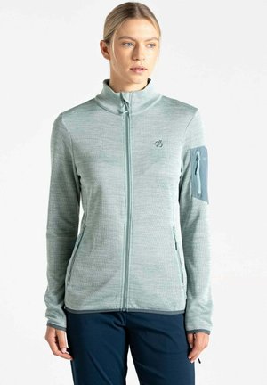 Hellblaues Zip-Jacket aus einem weichen, strukturierten Stoff. Verfügt über einen hohen Kragen, zwei seitliche Taschen und eine mit Reißverschluss versehene Armtasche.