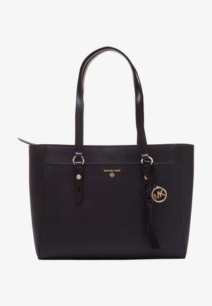 Czarna torba na ramię Michael Kors z podwójnymi uchwytami, złotą plakietką z logo i ozdobnym chwostem z przodu.