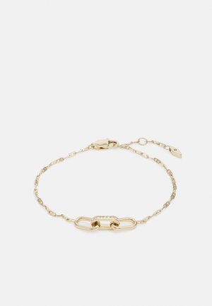 Bracelet en chaîne dorée avec un design de maillons entrelacés et une partie centrale ornée de petits strass transparents. Ajustable.