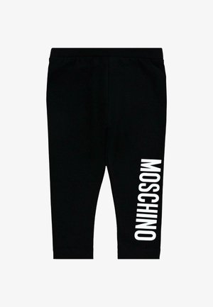 Leggings neri realizzati in tessuto elasticizzato con design aderente. Presentano un grande testo bianco "MOSCHINO" stampato verticalmente sulla gamba sinistra.
