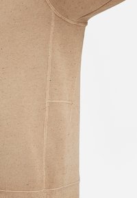 Brown sweatshirt made of textured fabric with a speckled pattern. Features a side pocket and visible seam details.