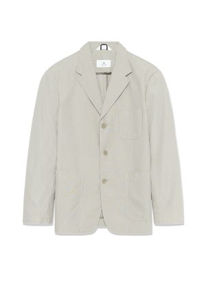 Blazer à rayures beige clair et blanc. Doté d'un col à revers, d'une fermeture à un bouton et de deux poches frontales. Tissu léger.
