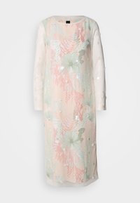 Bloemige jurk in pastelkleuren met lange semi-transparante mouwen, voorzien van borduursels en versieringen. Lichtgewicht stof met een ontspannen pasvorm.