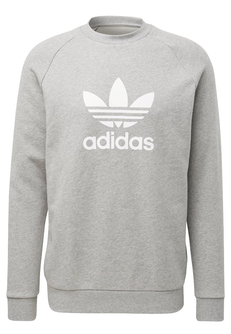 Šedá mikina z měkké látky. Má kulatý výstřih a dlouhé rukávy. Na přední straně je velké bílé logo Adidas se třemi pruhy.