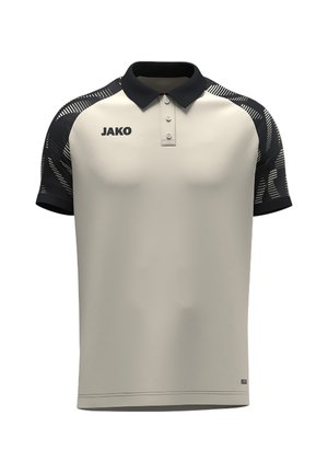 Beige polo-shirt med korte ærmer, sort krave og ærmer, mønstret design på ærmerne og "JAKO" logo på brystet.