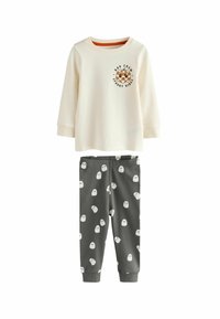 Creme kleurig lang mouwen shirt met "Spooky Vibes" print en grijze broek met witte spookpatronen. Zachte stof en geribbelde manchetten.