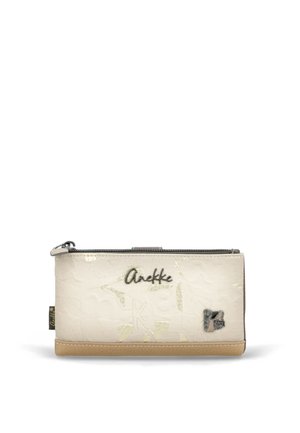 Beżowo-kremowy damski portfel z tłoczonym wzorem, metalowym logo „Anekke” oraz zapinany na zamek od góry.
