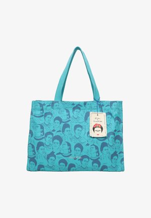 Bolsa de algodón en turquesa con ilustraciones repetidas en azul de una mujer con flores en el cabello. Incluye una etiqueta decorativa.
