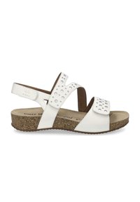 White leather sandal with perforated strap design, adjustable hook-and-loop closure, cork footbed, and textured rubber outsole.