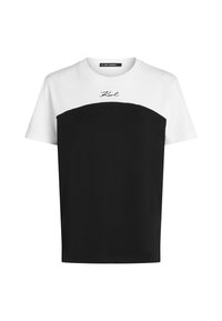 T-shirt z krótkim rękawem, z białą górną częścią i czarną dolną częścią, o zaokrąglonym wzorze i haftem "Karl" w kolorze czarnym.