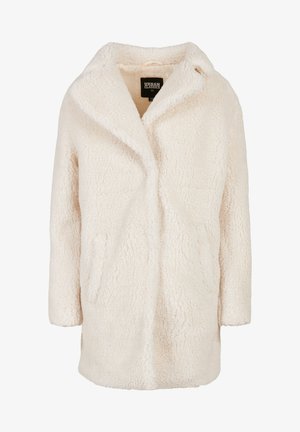 Fuzzy cream oversized coat with a shawl collar, two side pockets, and soft texture. Simple design with no visible closures or embellishments.