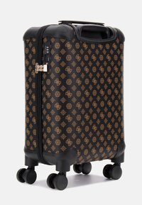 Black hard-shell suitcase with a gold geometric pattern, dual zippers, and a retractable handle, featuring four swivel wheels for mobility.