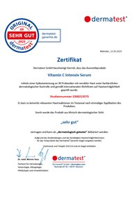 Zertifikat ausgestellt von Dermatest GmbH für das Vitamin C Intensivserum, mit offiziellen Logos, Datum und Studiennummer auf weißem Papier.