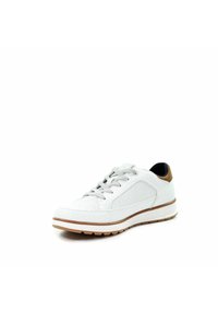 White low-top sneaker with brown accent on heel, perforated side panels, gray laces, and a rubber sole with tread pattern.