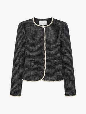 Black and white tweed jacket with a round neckline, braided trim, and two front pockets. Features a textured pattern throughout.