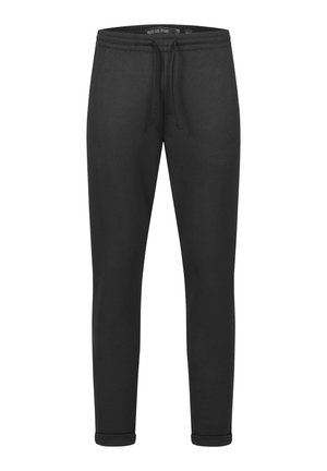 Black jogger pants made of soft fabric, featuring an elastic waistband with drawstring, tapered legs, and ribbed cuffs at the ankles.