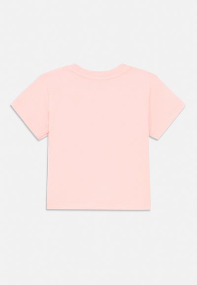 Plain light pink short-sleeve t-shirt laid flat showing the back side with a crew neckline on a white background.