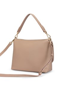 Beige leather handbag with a structured shape, single top handle, adjustable shoulder strap, and gold-tone hardware accents.