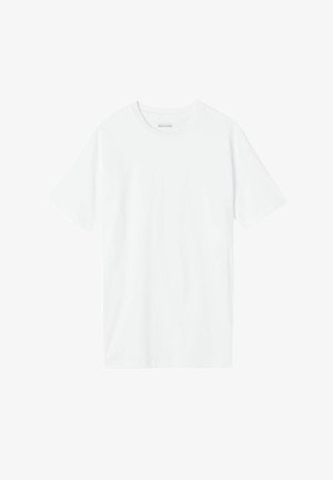 T-shirt bianco in cotone con scollo a giro e maniche corte, presenta una texture liscia e una vestibilità rilassata. Nessun motivo o dettaglio visibile.