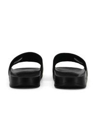 Black slide sandals with a smooth texture, open back design, and two upper straps. The sole is slightly raised and rounded.