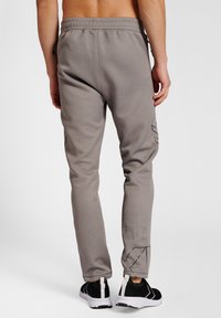 Hummel CIMA XK PANTS - Jogginghose - grey melange
