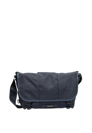 Black Timbuk2 messenger bag with adjustable shoulder strap, front flap secured by two buckles, and logo patch on front center.