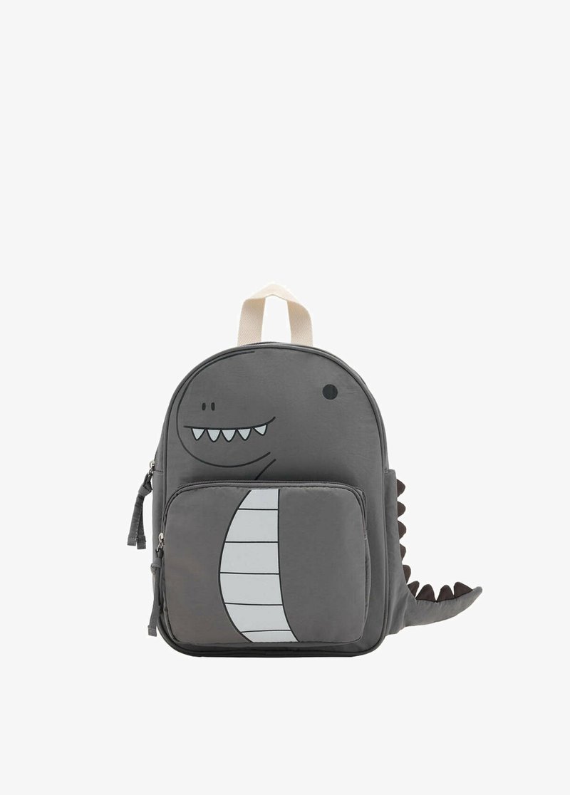 Sac à dos gris pour enfants avec un visage de dinosaure, des dents et une queue, avec une poche avant zippée et une poignée beige.