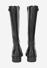 Bottes en cuir noir montantes avec une texture lisse, fermeture zippée à l'arrière et semelles en caoutchouc épaisses. Possède des sangles ajustables en haut.