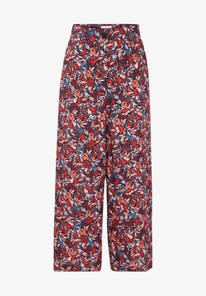 Floral wide-leg trousers in red, navy, and cream. Features a vibrant floral pattern with a high waist and a button closure.