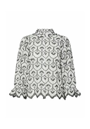 Vit blus med svart blommig broderi, krage och långa ärmar. Har en vågig fåll och samlade manschetter för textur.