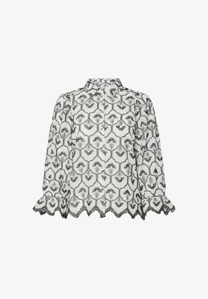 Balta bluze ar melniem ziedu izšuvumiem, ar apkakles dekoltē un garām piedurknēm. Satur viļņotu apakšmalu un rušinātus aproces, piedāvājot tekstūras daudzveidību.