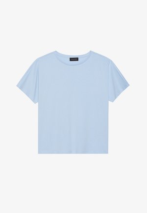 Svetlo modra kratkotrajna majica z mehkim blagom, s krožnim izrezom in ohlapnim krojem. Na etiketi piše "ANNA FIELD."