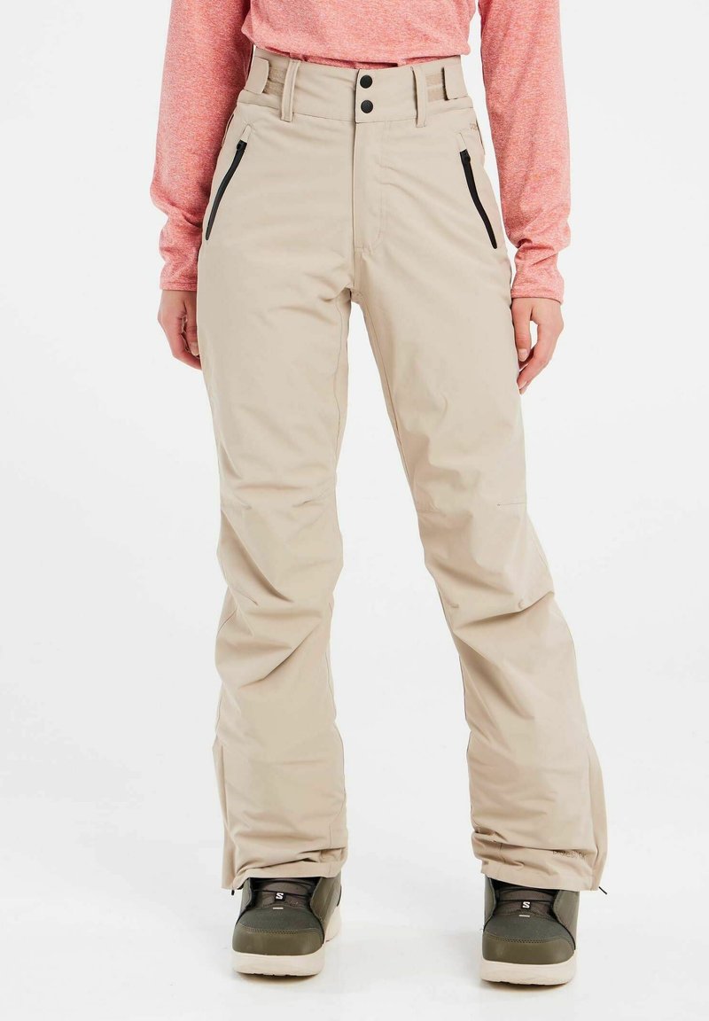 Beige skibroek met hoge taille, twee zwarte ritszakken en een recht gesneden ontwerp. Kenmerken zijn zichtbare stiksels en een minimalistische stijl.