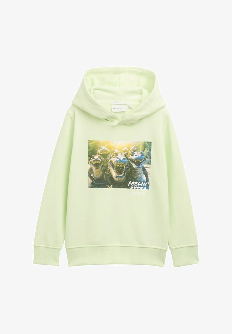 Hoodie vert clair en matériau doux. Présente un graphique de têtes d'alligator avec le texte "FEELIN' EXTRA GOOD" près du bas.
